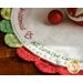 Green and red scalloped borders on the Home for Christmas Scalloped Table Topper