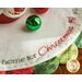 Green and red scalloped borders on the Home for Christmas Scalloped Table Topper