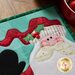 Close up details of the embellishments on Santa's hat