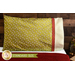 Bright green pillowcase with monkeys and a fun accent stripe resting on a bed
