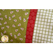 Close up of the green monkey fabric and red accent stripe on the Animal Crackers Magic Pillowcase.