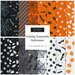 A collage of Halloween-themed fabrics in black, orange, and white included in the Holiday Essentials Halloween FQ Set.