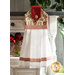 A beautiful red and white hanging towel with floral designs hung from a cabinet