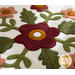 The center floral applique on the In Full Bloom - Wool Mat