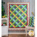 The On The Go Home & Away quilts hung from a wall and draped over a chair