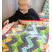 Cute child admiring the smaller Away Quilt - On The Go