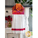 A beautiful magenta and orange hanging towel displayed on a cabinet