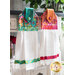 The two coordinating Kasada Hanging Towels hung from a cabinet