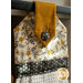 A close up of the decorative fabric covered button in the Bee Grateful Hanging Towel
