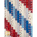 A close up of the red, white, and blue fabric strips making up the Standing Strong Quilt