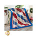 The America the Beautiful - Standing Strong Quilt draped over a chair