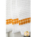 Orange gingham accent stripe against a white waffle weave toweling