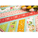 Colorful Strawberry Honey fabrics and zig zag piecing on the Greased Lightning Table Runner