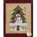 Block 8 of the Winter Wonderland Laser Cut Quilt featuring a Christmas tree with a snowman on it