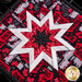 A close up of the center star design in the Folded Star Squared Hot Pad - Peace, Love & BBQ