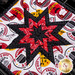 The center star design of the Peace, Love & BBQ Folded Star Squared Hot Pad