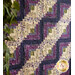 The beautiful log cabin design stripes on the Log Cabin Throw Quilt made with Violet Hill Fabrics