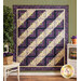 Log Cabin Throw Size Quilt in Violet Hill fabrics displayed on a wall