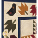 Tossed leaf blocks and a bird block in the border of the Autumnville Quilt