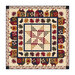 Geometric autumn themed quilt on a white background