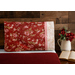 Beautiful red, cream and pink floral pillowcase on a bed | Shabby Fabrics