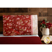 Beautiful red, cream and pink floral pillowcase on a bed | Shabby Fabrics