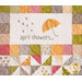 Quilt block with a laser cut umbrella and embroidered raindrops and the words 