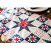 The center star design in the Land of Liberty Strippy Stars Table Runer