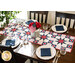 A beautiful set table with a patriotic table runner theme