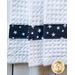 Navy blue fabric with white stars accenting the white waffle weave toweling