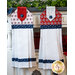 The white and red Land of Liberty hanging towels hung from a cabinet