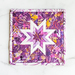 Isolated image of purple and pink folded star hot pad