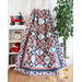 Red white and blue quilt draped over furniture.