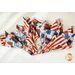 Four beautiful patriotic-themed Cloth Napkins laid on a white table