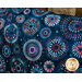 Fabric with red, white, and blue bursting fireworks on a blue background
