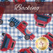 White fabric featuring blue gingham with red and blue trucks.