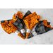 Orange and black Halloween themed cloth napkins.