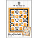 Front view of Star of the Patch pattern package with orange and black quilt design