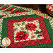 Six Christmas themed placemats with florals, on wood table