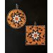 Halloween themed hot pads with central folded star design made with orange fabric featuring black cats.