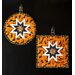 Two hot pads with central folded star featuring orange fabric and bats.