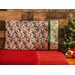 Pillowcase featuring Christmas gift tags with holiday phrases and holly with ribbons on the right edge.