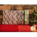 Pillowcase featuring Christmas gift tags with holiday phrases and holly with ribbons on the right side edge.