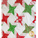 Christmas quilt featuring green and red stars on white background.
