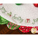 White Scalloped Table Topper with red and green scallops featuring Christmas themed embroidery of the word 