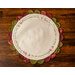 Cream Scalloped Table Topper with muted red and green scallops featuring Christmas themed embroidery.