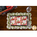 Christmas themed scalloped placemat featuring red trucks, wagons, and pine trees.
