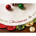 Green and red scalloped borders on the Home for Christmas Scalloped Table Topper featuring embroidery