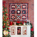 Nine block quilt featuring cocoa mugs in red, black, and white hanging on brick wall above three hot cocoa wall hangings.
