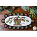 Penny rug featuring a basket filled with holly design with the word holly and scallops.